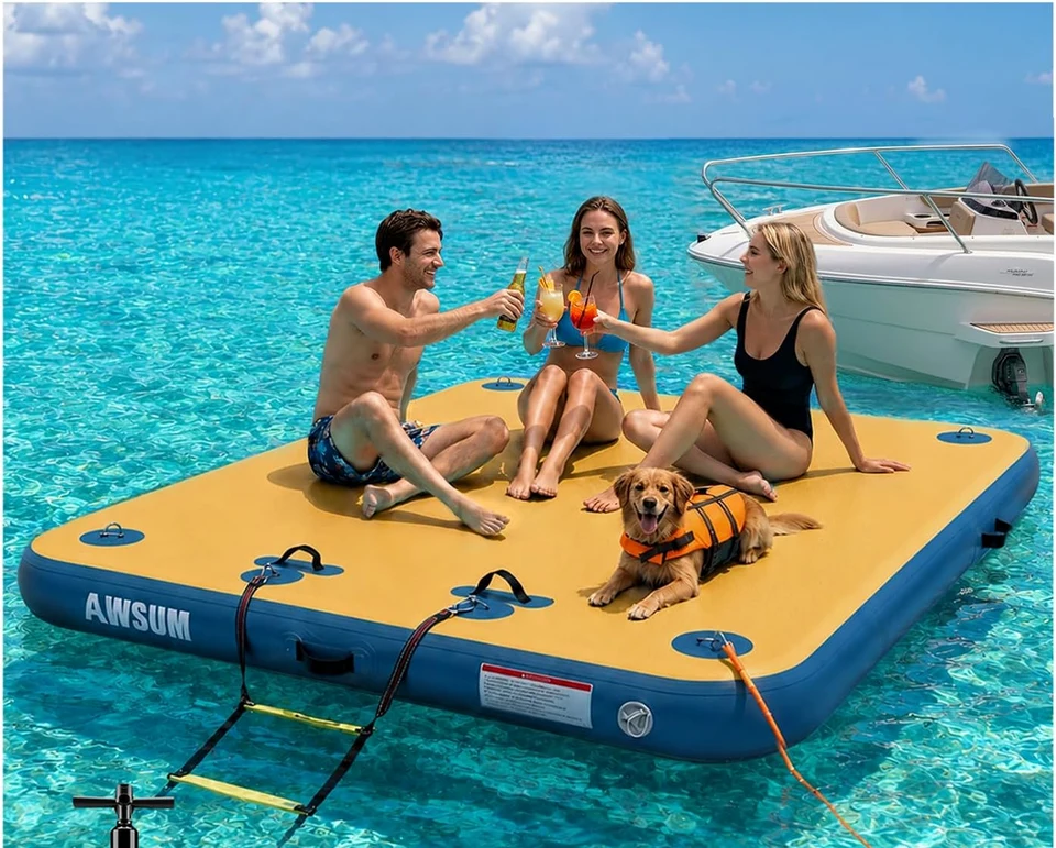 Friends relaxing on a blue AWSUM floating dock beside a boat